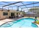 Beautiful screened-in pool with a spa, fountain, and covered patio for outdoor entertaining at 525 Southport Dr, Longwood, FL 32750