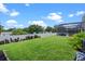 Expansive backyard featuring a lush green lawn, privacy fence, and manicured landscaping providing an outdoor retreat at 548 Casterton Cir, Davenport, FL 33897