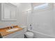 Well-lit bathroom featuring a vanity with cultured marble countertop and a shower-tub combo at 548 Casterton Cir, Davenport, FL 33897