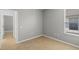 This bedroom features neutral paint, tile flooring, and a window with natural light at 548 Casterton Cir, Davenport, FL 33897