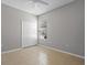 Bedroom featuring tile floor, a ceiling fan, and a closet next to the window at 548 Casterton Cir, Davenport, FL 33897