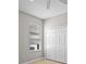 Bedroom featuring a window and a closet with louvered double doors at 548 Casterton Cir, Davenport, FL 33897