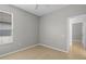 Bright bedroom featuring neutral paint, tile flooring, and a window with natural light at 548 Casterton Cir, Davenport, FL 33897