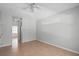 Spacious bedroom with ensuite bathroom, tile flooring, vaulted ceiling and ceiling fan at 548 Casterton Cir, Davenport, FL 33897