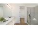 Modern bathroom with a glass-enclosed shower, sleek vanity, and contemporary fixtures, offering a spa-like experience at 5652 Nevis Ter, Kissimmee, FL 34758