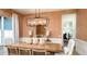 Elegant dining room with modern lighting and decor, perfect for hosting dinner parties and gatherings at 5652 Nevis Ter, Kissimmee, FL 34758