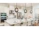 Spacious kitchen with stainless steel appliances, a large island, and pendant lighting, ideal for entertaining at 5652 Nevis Ter, Kissimmee, FL 34758