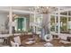 Elegant dining room with modern chandelier, mirrored accent wall, and stylish decor at 5658 Nevis Ter, Kissimmee, FL 34758