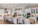 Bright kitchen featuring stainless steel appliances, a spacious island, and pendant lighting at 5658 Nevis Ter, Kissimmee, FL 34758