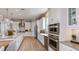 Modern kitchen with stainless steel appliances, quartz countertops, and ample cabinet space at 5658 Nevis Ter, Kissimmee, FL 34758