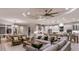 Open concept living room showcasing modern furnishings, an adjacent dining area and a gourmet kitchen at 5658 Nevis Ter, Kissimmee, FL 34758