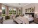 Comfortable bedroom featuring a large window, neutral colors, and a desk area at 5658 Nevis Ter, Kissimmee, FL 34758