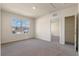 Well-lit bedroom featuring neutral walls, plush carpet, a window with a neighborhood view, and an open closet at 5896 Galloping Dr, Apopka, FL 32712