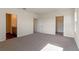 Spacious bedroom featuring carpet, and doorways leading to the bathroom and closet at 5896 Galloping Dr, Apopka, FL 32712