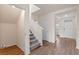 Inviting entryway with staircase, closet, and neutral color palette at 5896 Galloping Dr, Apopka, FL 32712