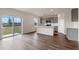 Modern kitchen with gray cabinets, quartz countertops, stainless steel appliances, and sliding glass doors at 5896 Galloping Dr, Apopka, FL 32712