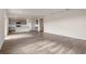 Expansive living room with wood-look floors leading to a modern kitchen at 5896 Galloping Dr, Apopka, FL 32712