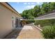 Charming backyard patio with brick pavers and privacy landscaping, perfect for relaxing and enjoying outdoor living at 5973 Chesapeake Park # 58, Orlando, FL 32819