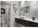 Well-lit bathroom featuring a modern vanity, a glass shower, and stylish fixtures at 5973 Chesapeake Park # 58, Orlando, FL 32819