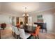 Beautiful dining room with a dark wood table, comfortable seating, and modern decor at 5973 Chesapeake Park # 58, Orlando, FL 32819