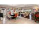 Open-concept dining and living area with fireplace, hardwood floors, and sliding glass doors to the backyard at 5973 Chesapeake Park # 58, Orlando, FL 32819