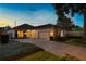 Charming single-story home with a two-car garage, well-manicured landscaping, and a private driveway at 5973 Chesapeake Park # 58, Orlando, FL 32819