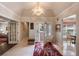 Bright foyer with marble floors, statement lighting, and seamless flow to living and dining areas at 5973 Chesapeake Park # 58, Orlando, FL 32819