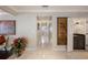 Bright hallway featuring elegant marble floors, neutral walls, and decorative wall art enhancing the home's aesthetic appeal at 5973 Chesapeake Park # 58, Orlando, FL 32819