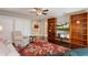 Spacious living room boasts built-in bookshelves, a ceiling fan, and comfortable seating with an adjacent view to another room at 5973 Chesapeake Park # 58, Orlando, FL 32819
