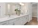 Bright bathroom features a double vanity, quartz countertop, undermount sinks, and ample storage space at 6035 Blue View Way, St Cloud, FL 34771