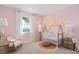 Charming Bedroom painted in light pink with a hand painted sunburst mural at 6035 Blue View Way, St Cloud, FL 34771