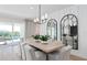 Bright dining room features large sliding doors to the pool and spa beyond at 6035 Blue View Way, St Cloud, FL 34771