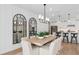 Chic dining room with modern mirrors and open-concept design connecting to the kitchen at 6035 Blue View Way, St Cloud, FL 34771