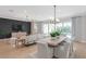 Bright living space with dining area, views through large windows, and comfortable seating at 6035 Blue View Way, St Cloud, FL 34771