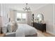 Main bedroom features wood look floors, large window and lots of natural light at 6035 Blue View Way, St Cloud, FL 34771