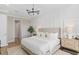 Airy main bedroom features wood look floors, paneling and lots of natural light at 6035 Blue View Way, St Cloud, FL 34771