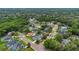 Aerial view of a residential neighborhood highlighting tree-lined streets and well-maintained homes at 605 Macglenross Dr, Oviedo, FL 32765