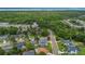 This aerial view shows a neighborhood with lush greenery and manicured lawns, providing a serene and inviting atmosphere at 605 Macglenross Dr, Oviedo, FL 32765