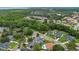 This aerial shows a vibrant neighborhood with lush greenery, well-maintained homes, and community amenities at 605 Macglenross Dr, Oviedo, FL 32765
