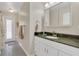 Bathroom featuring a vanity with a green countertop, ample lighting, and tiled floors at 605 Macglenross Dr, Oviedo, FL 32765