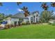 Attractive single-story house boasting manicured front lawn and tasteful landscaping elements at 605 Macglenross Dr, Oviedo, FL 32765