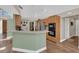 Spacious kitchen with breakfast bar, stainless steel appliances, and wood cabinetry, well-illuminated at 605 Macglenross Dr, Oviedo, FL 32765