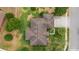 An aerial view of the roof and yard showing the home's placement on the lot and mature trees at 611 Curly Fern Ln, Deland, FL 32720