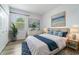 Comfortable bedroom with soothing colors, plush bedding, and beach-themed artwork for a relaxing atmosphere at 611 Curly Fern Ln, Deland, FL 32720