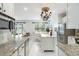 Updated kitchen and dining area with granite counters and stainless steel appliances at 611 Curly Fern Ln, Deland, FL 32720