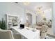 Bright office space featuring archway details, a chandelier, and a view to the dining area at 611 Curly Fern Ln, Deland, FL 32720