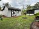 View of backyard with shed and greenery at 6615 Beamer Way, Orlando, FL 32807
