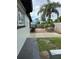 View of backyard, sidewalk, and house exterior at 6615 Beamer Way, Orlando, FL 32807