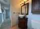 Bathroom features a stylish vanity, vessel sink, updated fixtures, and tile flooring for a modern appeal at 6615 Beamer Way, Orlando, FL 32807