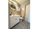 Functional bathroom with a sink, toilet, and mirrored cabinet for essential needs at 6615 Beamer Way, Orlando, FL 32807